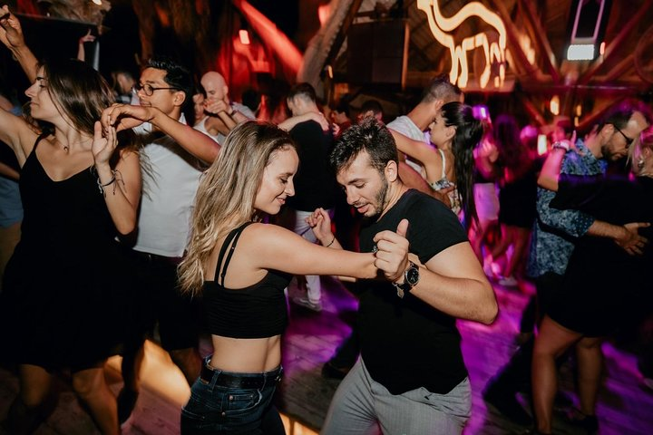 Immerse yourself in an exciting salsa night connecting with fellow travelers while dancing to lively rhythms at Dubai's hottest venue creating unforgettable memories and friendships.